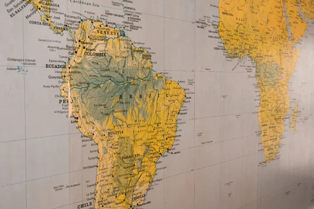 Wall map of South America and Africa used for country analysis